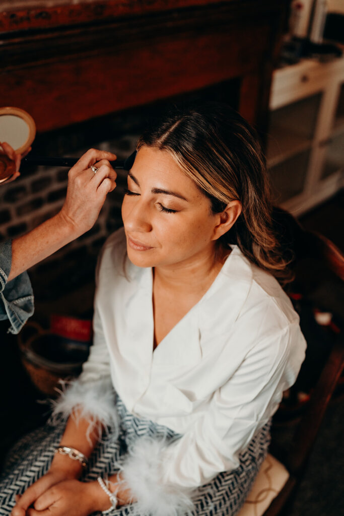 bride in makeup chair