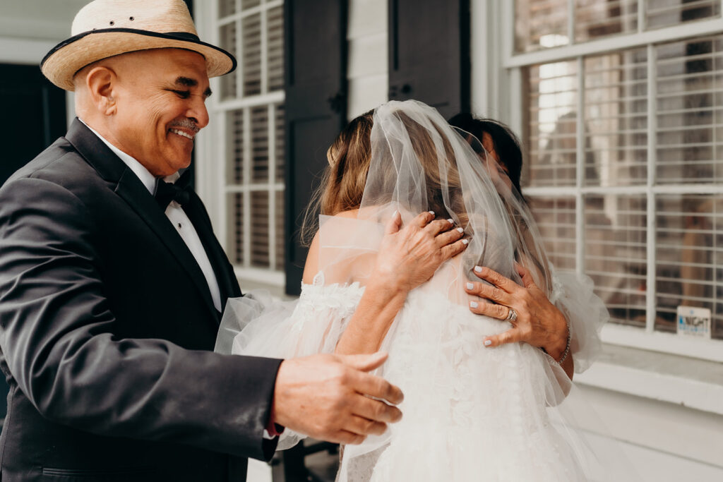 bride hugging her parents