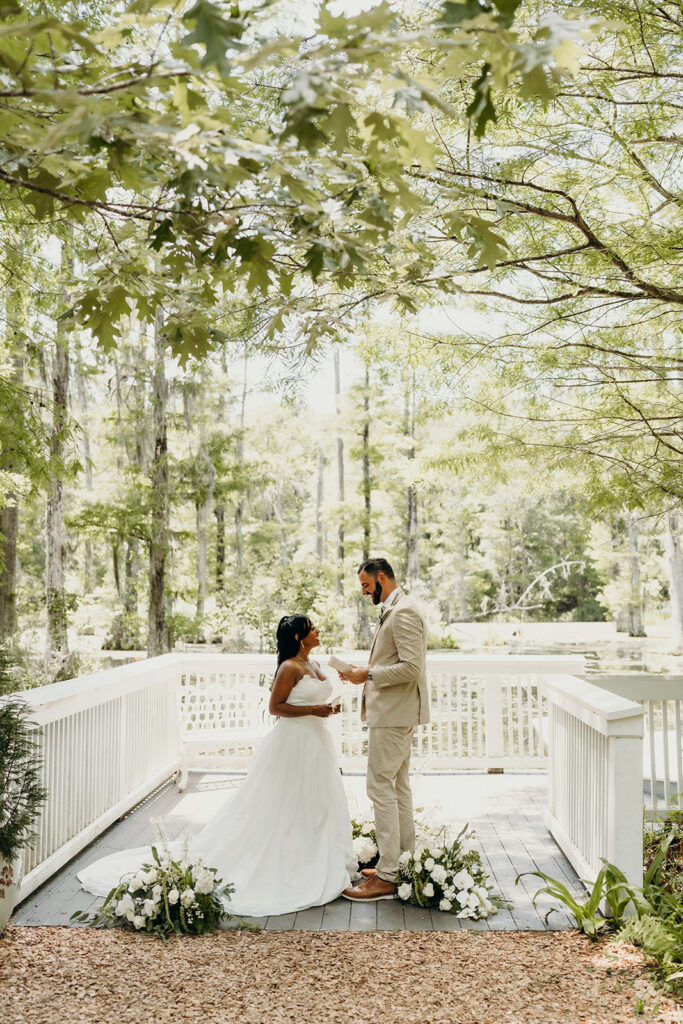 Romantic Elopement at Cypress Gardens - Ceremony by the dock exchanging vows