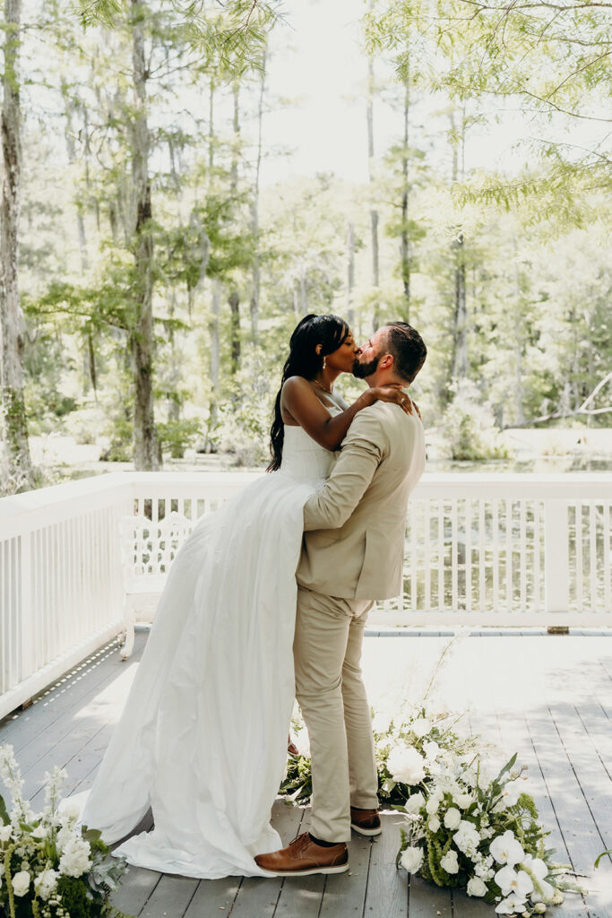 Romantic Elopement at Cypress Gardens - Ceremony by the dock first kiss