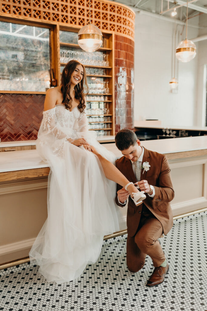 bride and groom first look at bar