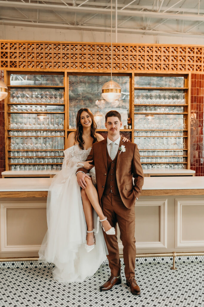 bride and groom first look at bar