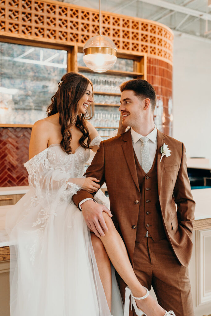 bride and groom first look at bar