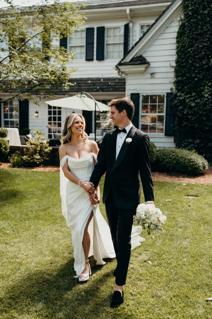 Candid first look portraits in courtyard 