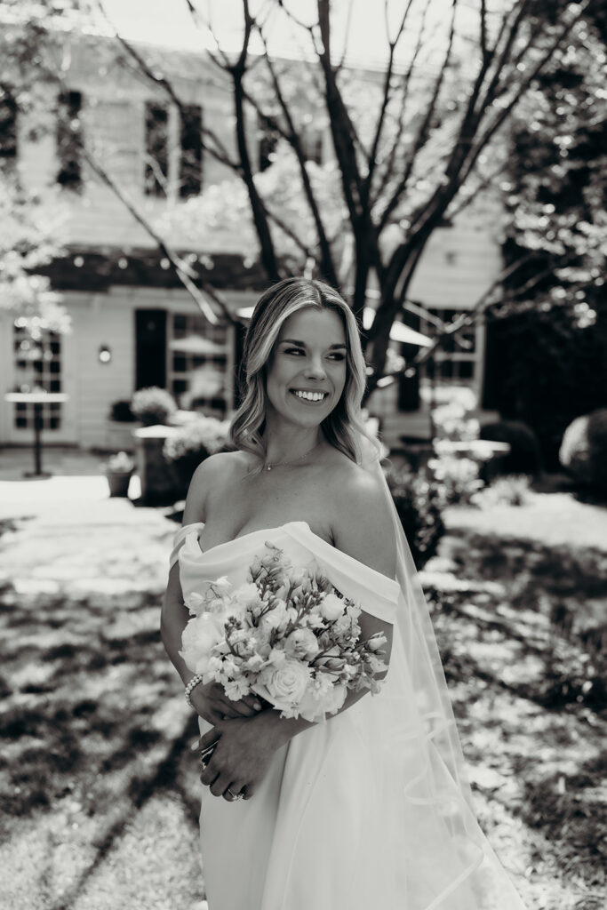 Candid first look portraits in courtyard