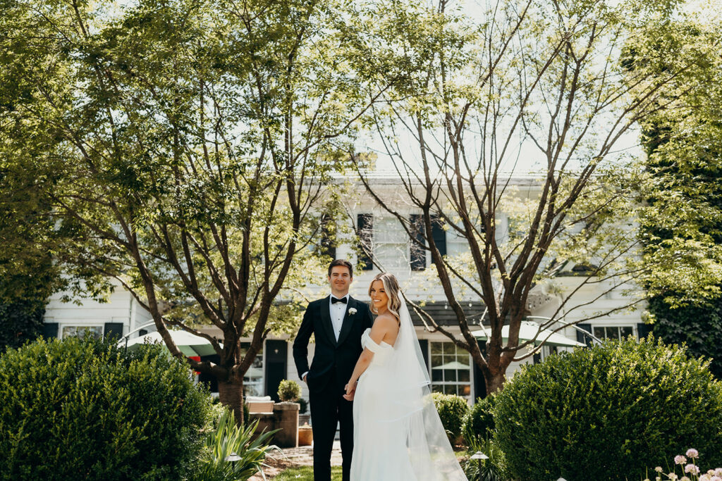 Candid first look portraits in courtyard