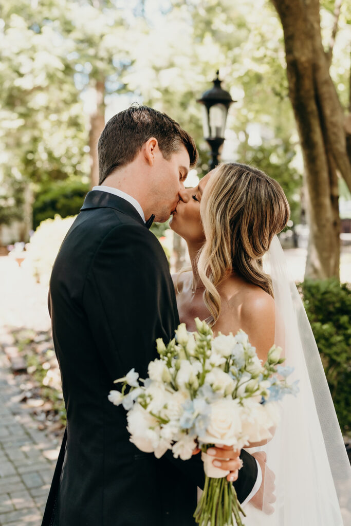 Candid first look portraits in courtyard