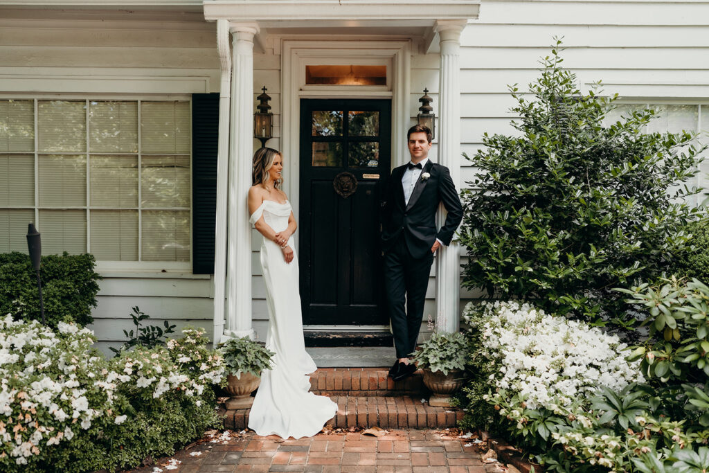 Candid first look portraits in courtyard