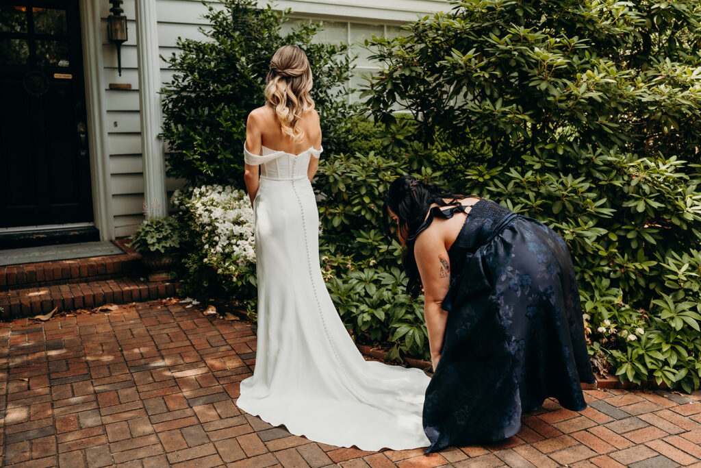 Candid first look portraits in courtyard