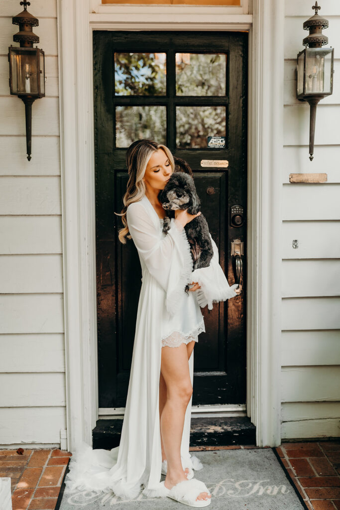 Getting ready photos featuring the brides little dog with bride in robe