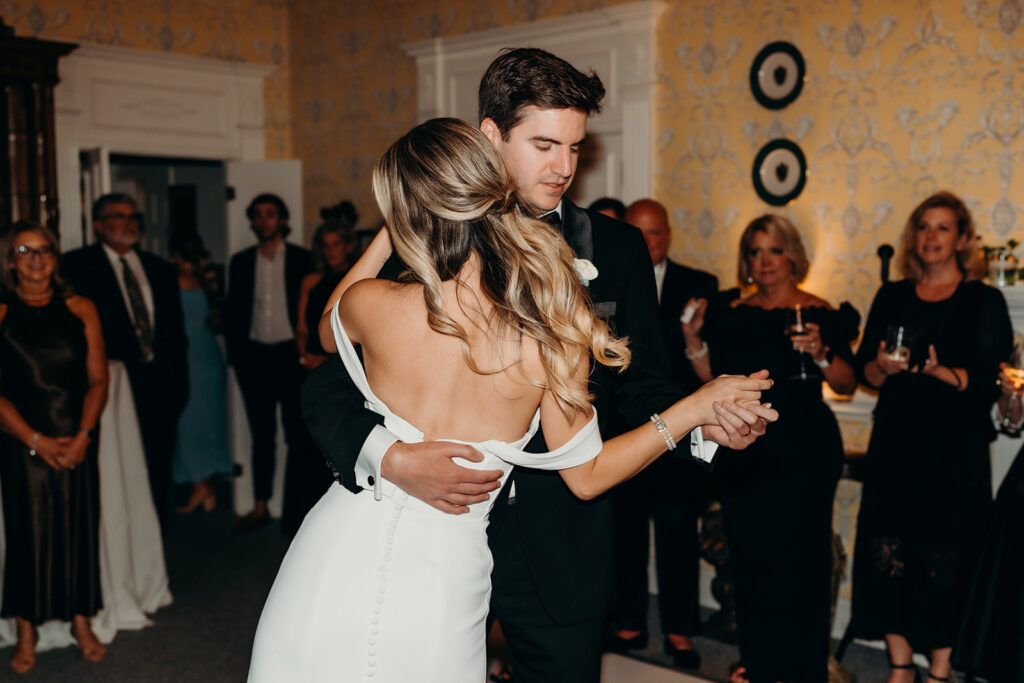 Summer wedding reception with checkered dance floor first dance