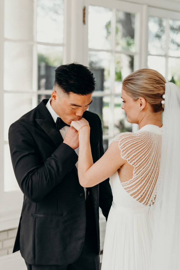 bride and groom first look on checkered floors at separk mansion