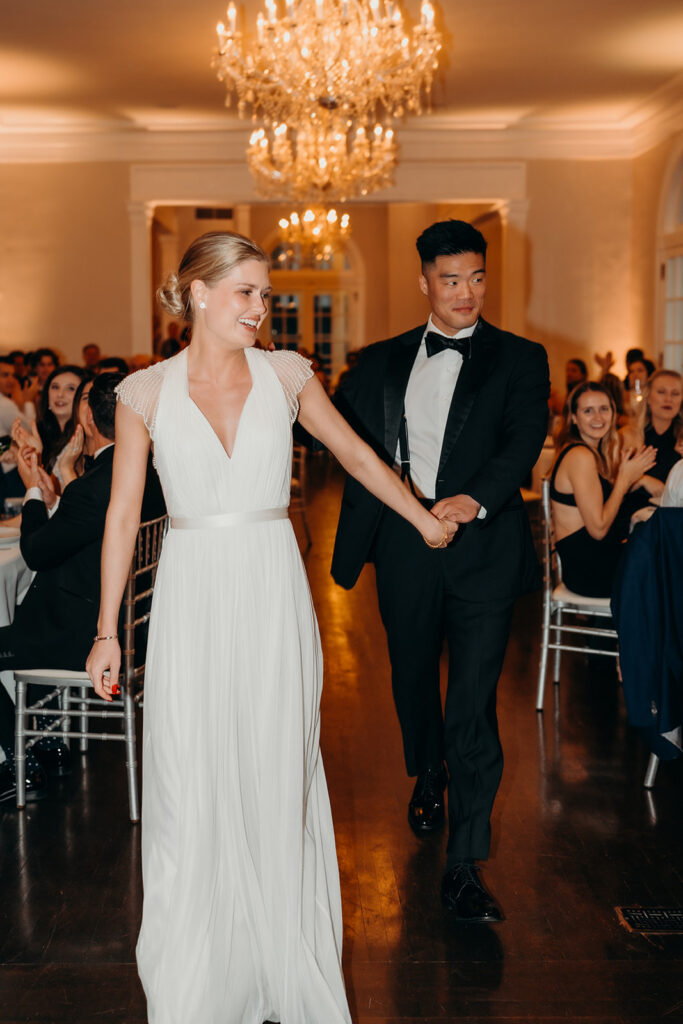 bride and groom entering reception
