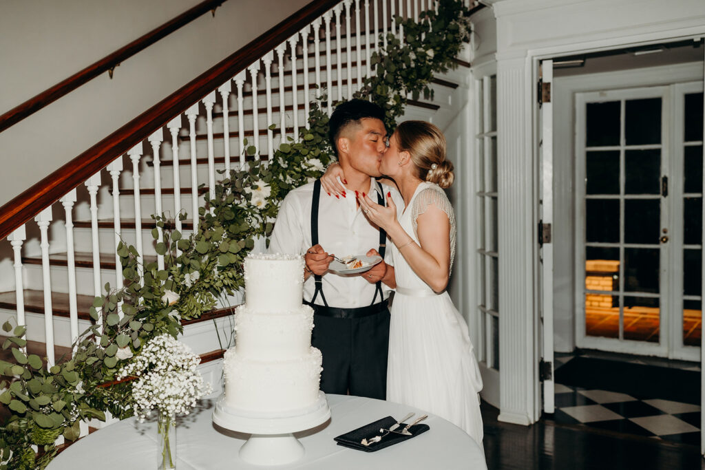 bride and groom cutting the cake