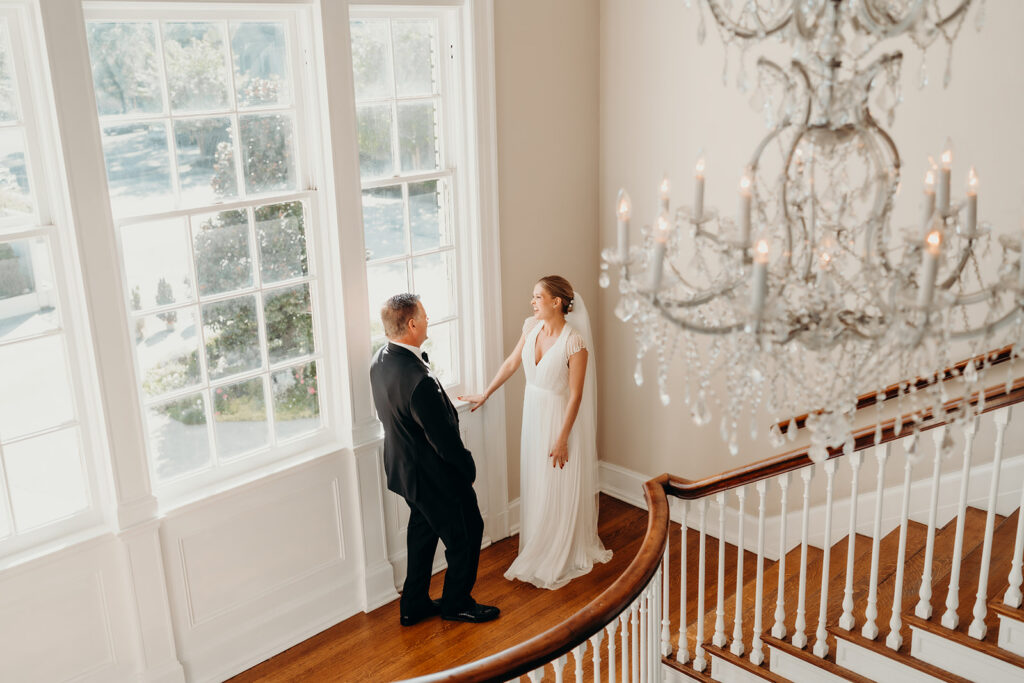 bride and dad first look on steps