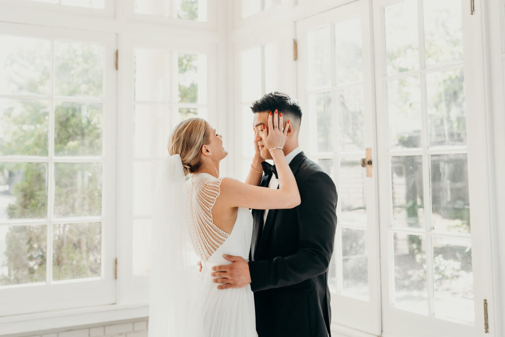 bride and groom first look on checkered floors at separk mansion