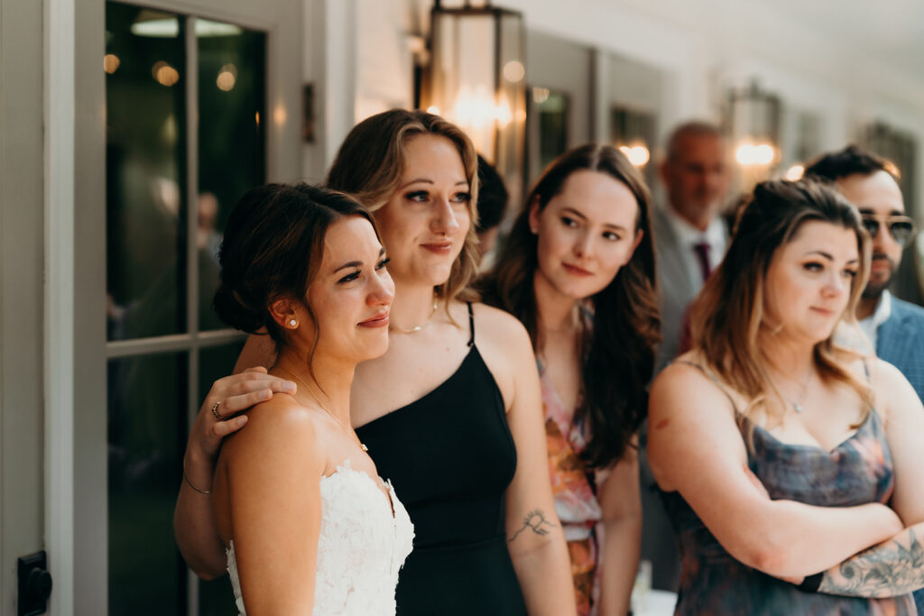 reception outdoors with checkered floor dance floor, happy tears, first dances, and toasts