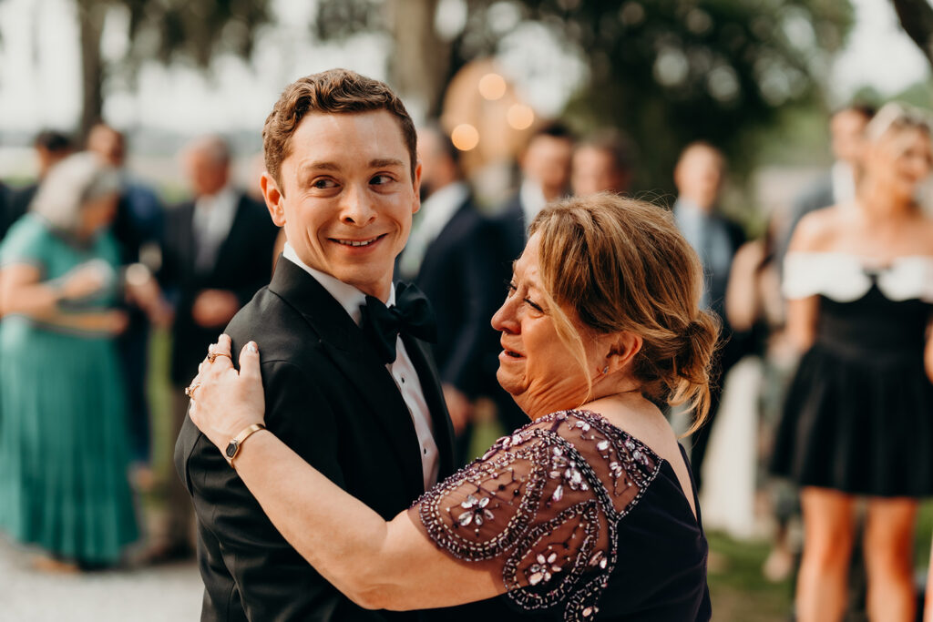reception outdoors with checkered floor dance floor, happy tears, first dances, and toasts