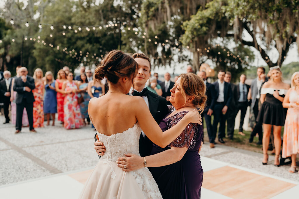 reception outdoors with checkered floor dance floor, happy tears, first dances, and toasts