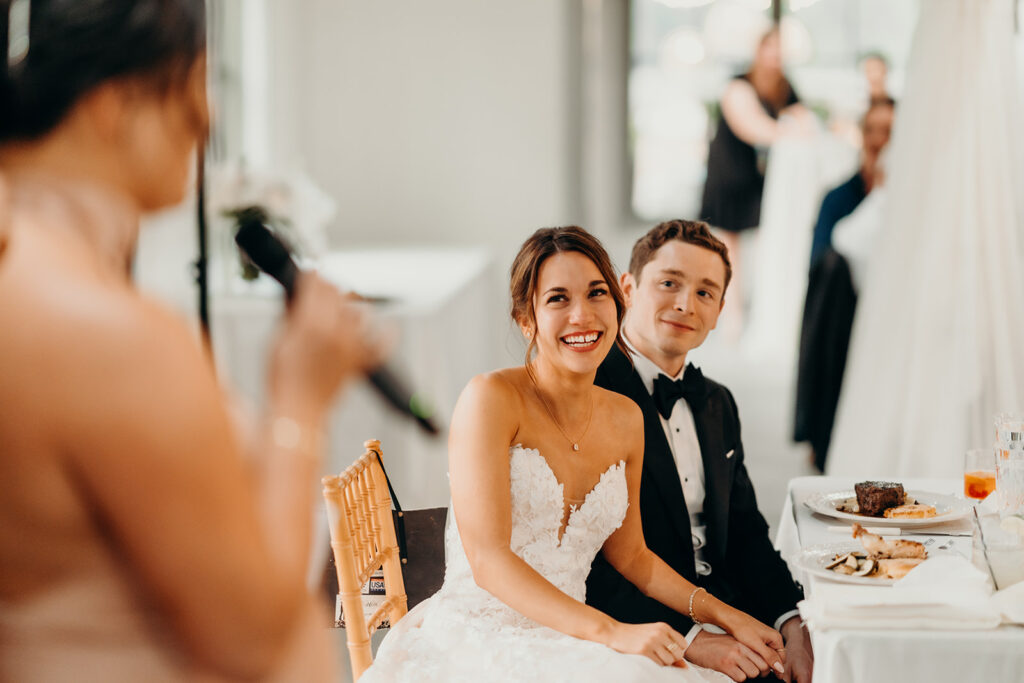 reception outdoors with checkered floor dance floor, happy tears, first dances, and toasts