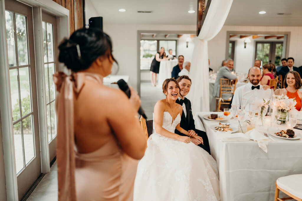 reception outdoors with checkered floor dance floor, happy tears, first dances, and toasts