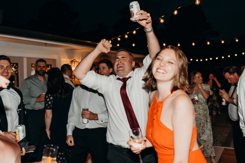 lively energetic dance floor outdoors with market lights and live sax