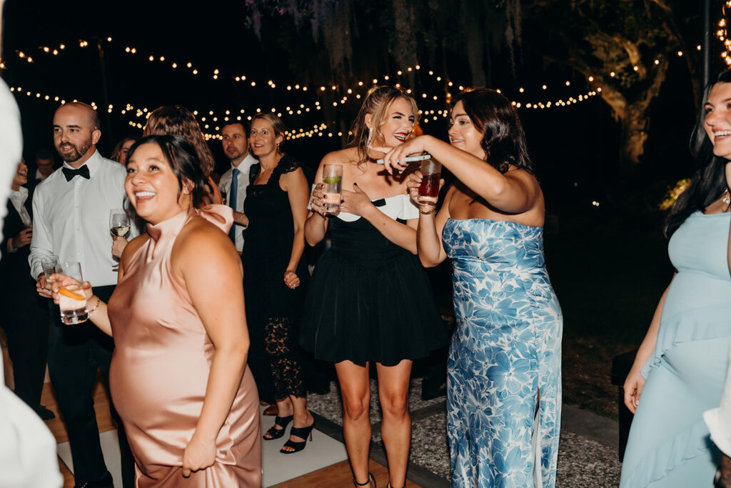 lively energetic dance floor outdoors with market lights and live sax