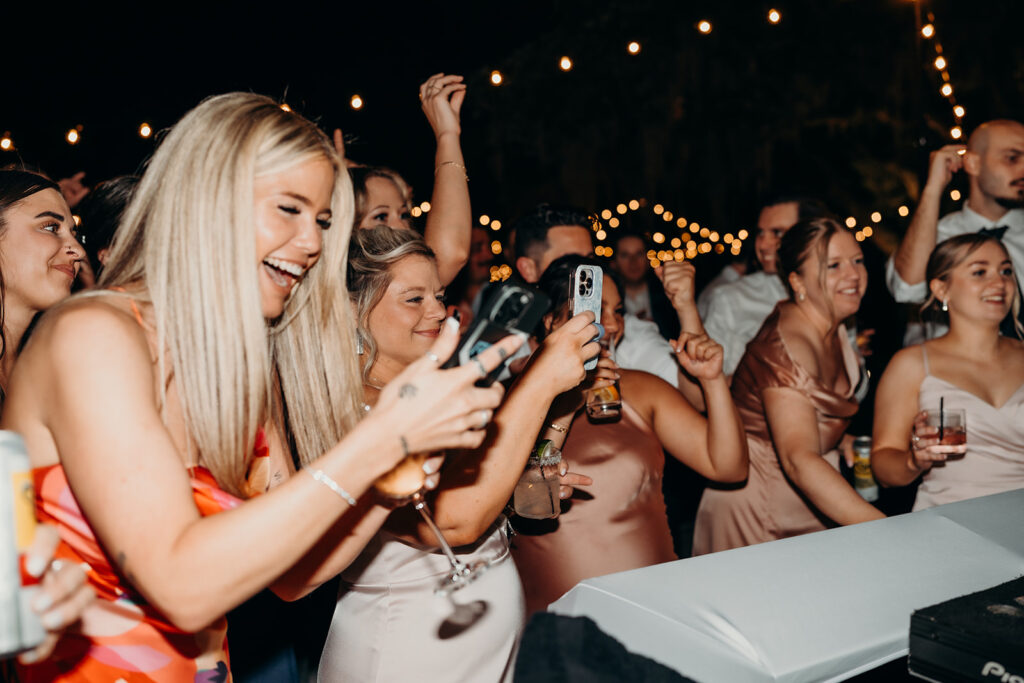 lively energetic dance floor outdoors with market lights and live sax