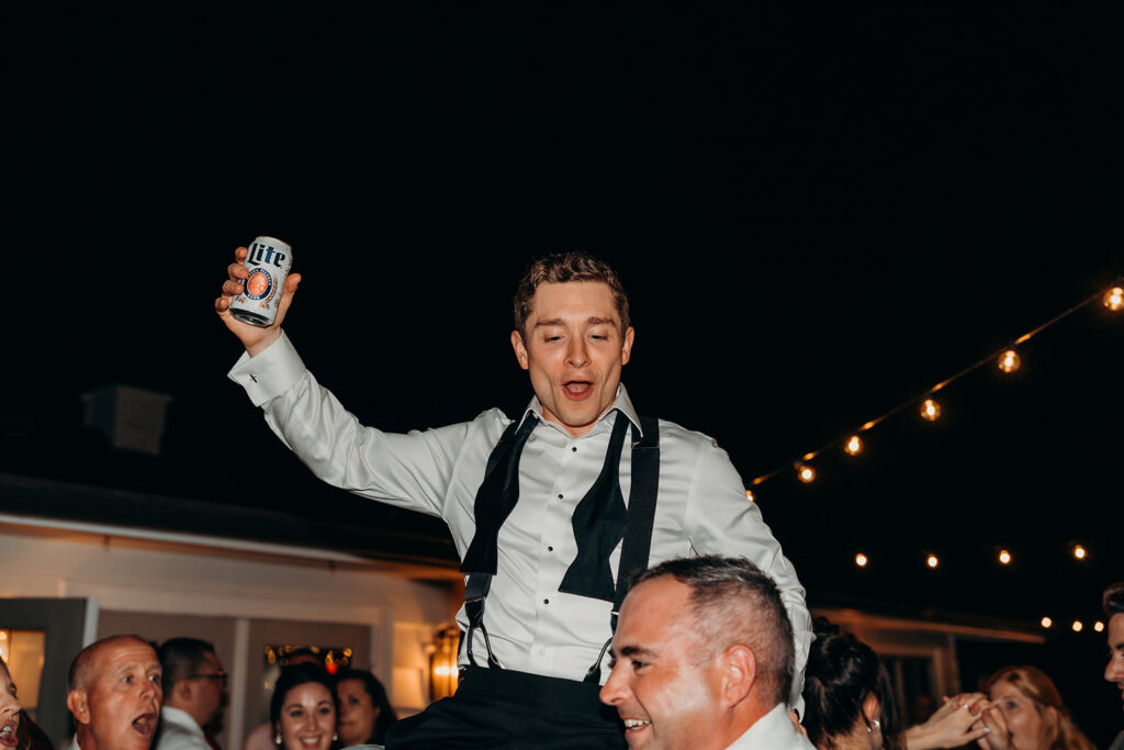 lively energetic dance floor outdoors with market lights and live sax
