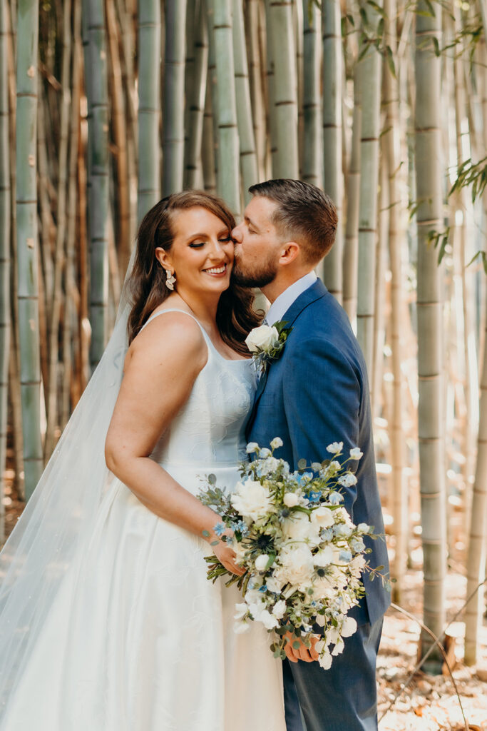 couple kissing in bamboo woods