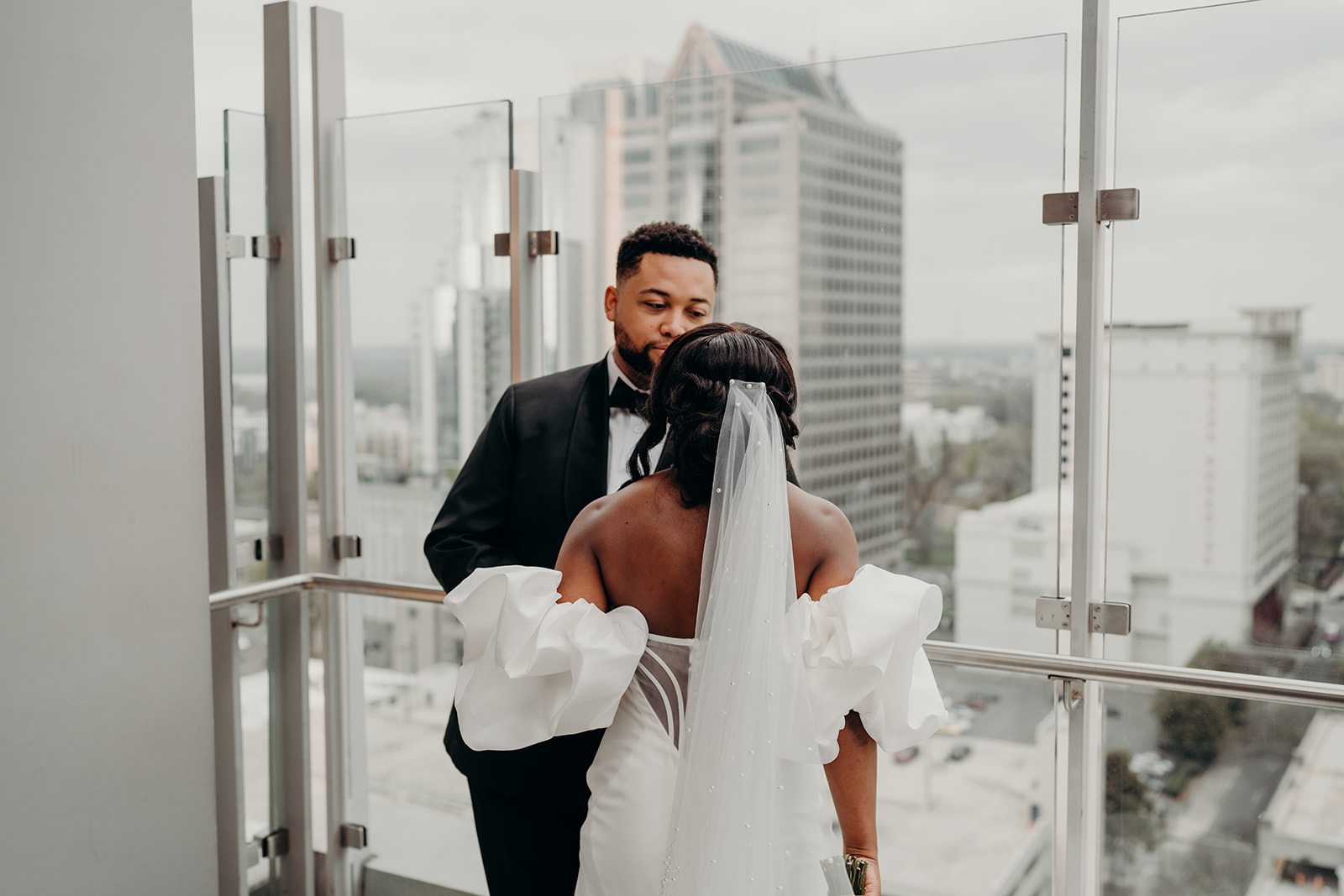 couple on top of the kimpton tryon hotel wedding venue