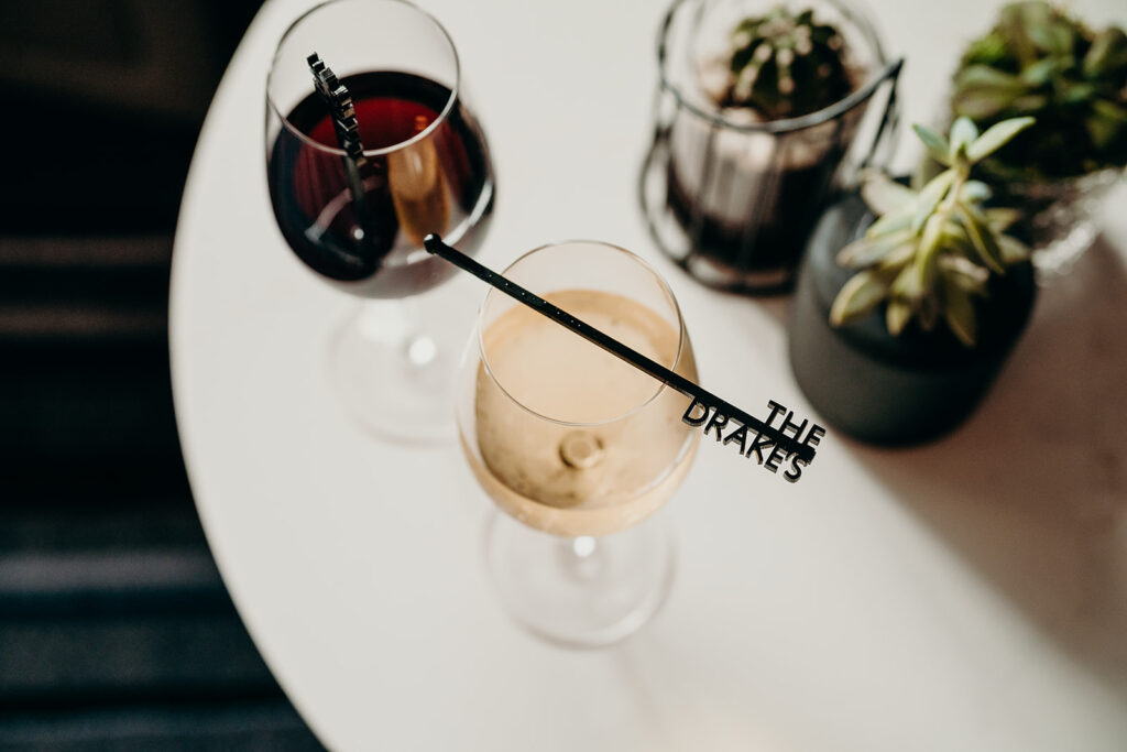Charlotte Ballroom Wedding Venues photo of wine glasses with couples signature drink stir