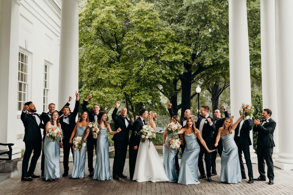 wedding party celebrating outside of a country club wedding venue