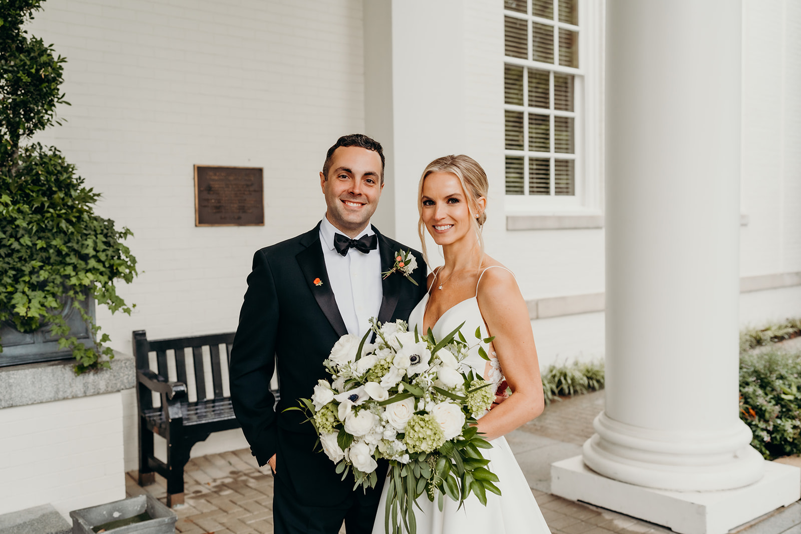 couple smiling at camera in from of a Charlotte Country Club Wedding Venues