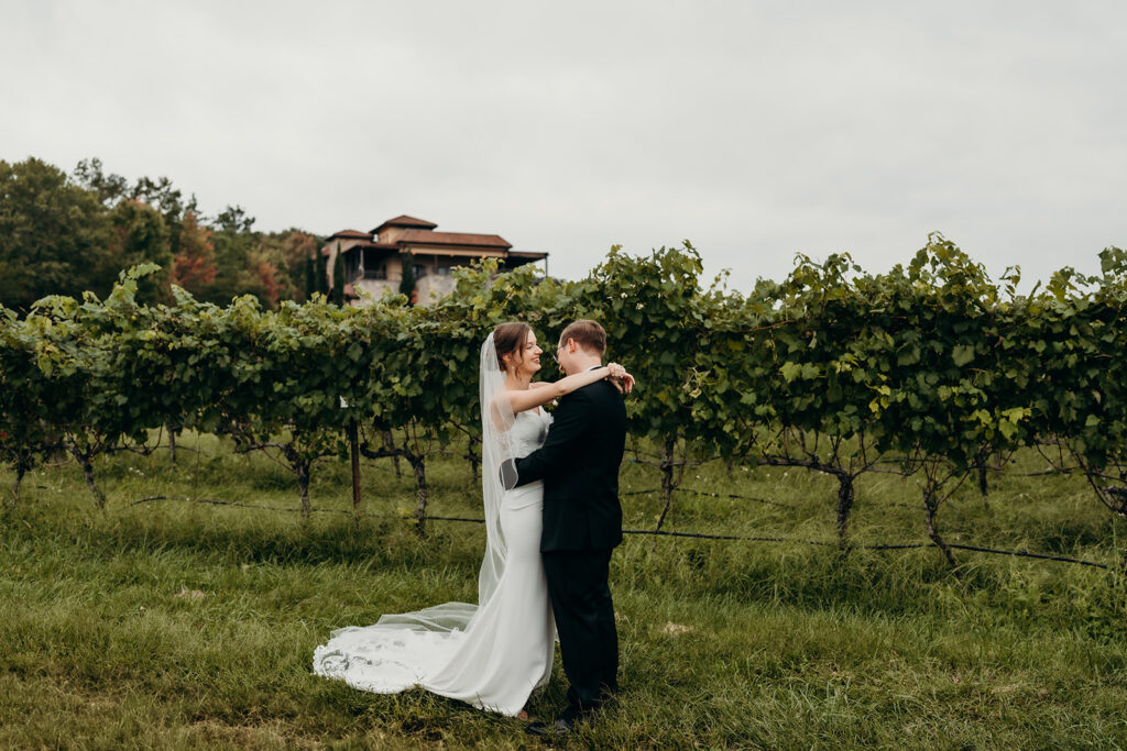 first look between bride and groom in the vines at a Vineyard Wedding Venues in Charlotte