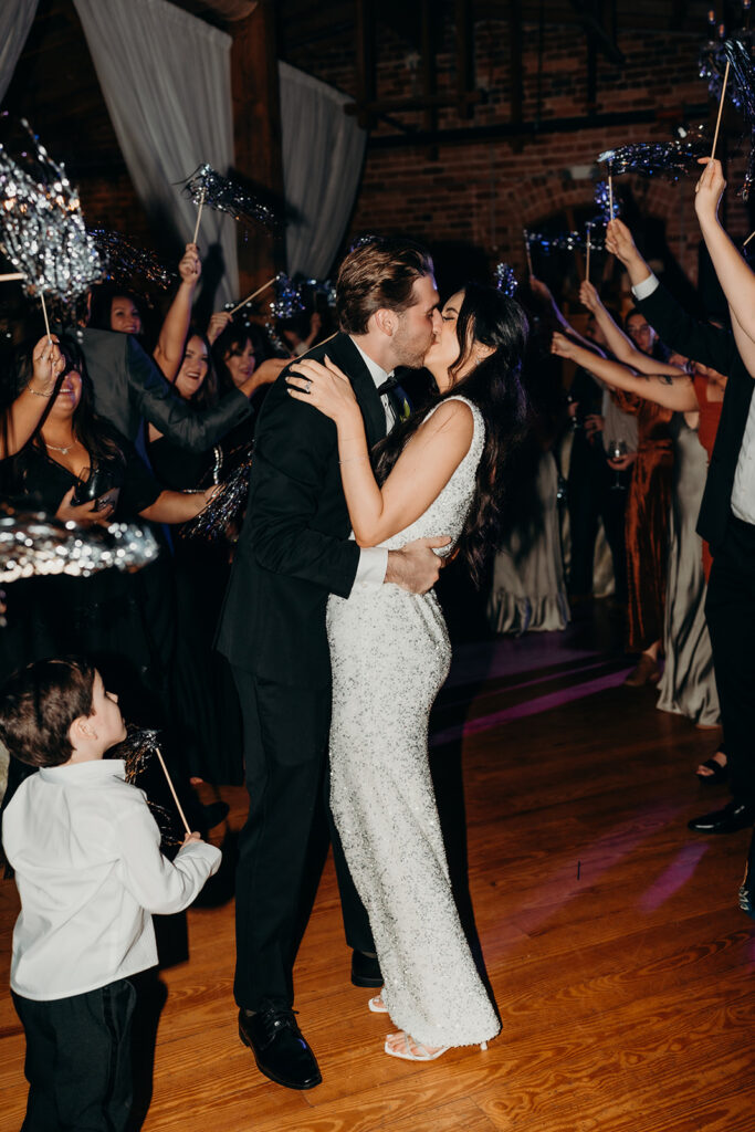 couple celebrating on the dance floor of their reception at Melrose Knitting Mill