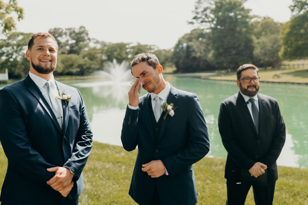 groom crying as the bride walks down the aisle at the rose hill estate wedding
