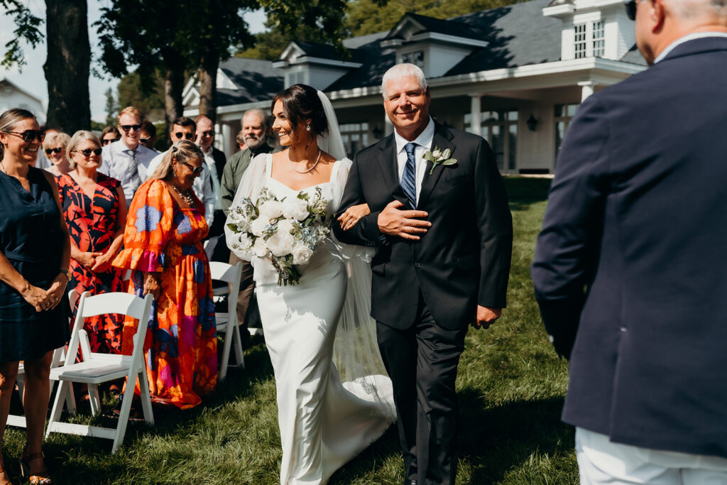 bride walks down the aisle at the rose hill estate wedding