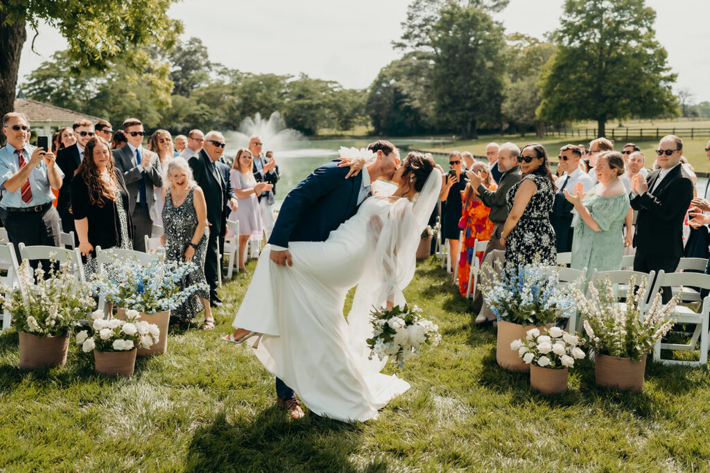 bride and groom walking down the aisle as husband and wife at their rose hill estate wedding