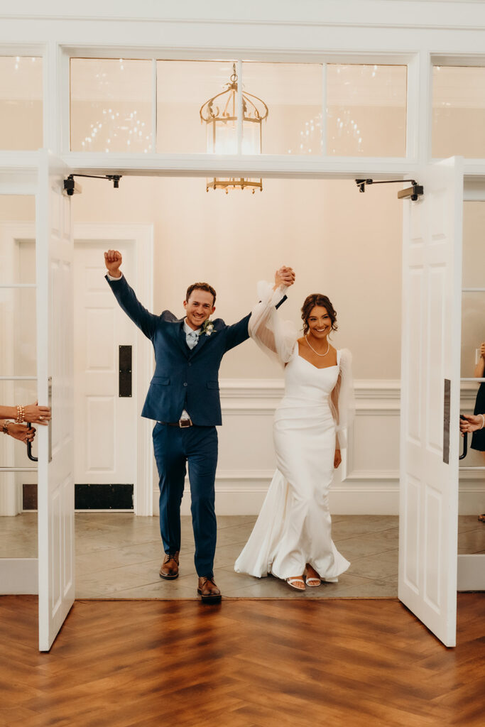 bride and groom entering their reception at their rose hill estate wedding