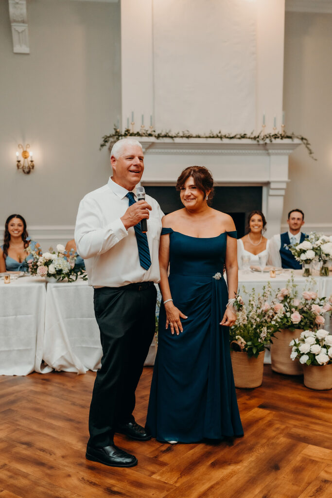 wedding reception toasts in the grand hall at their rose hill estate wedding