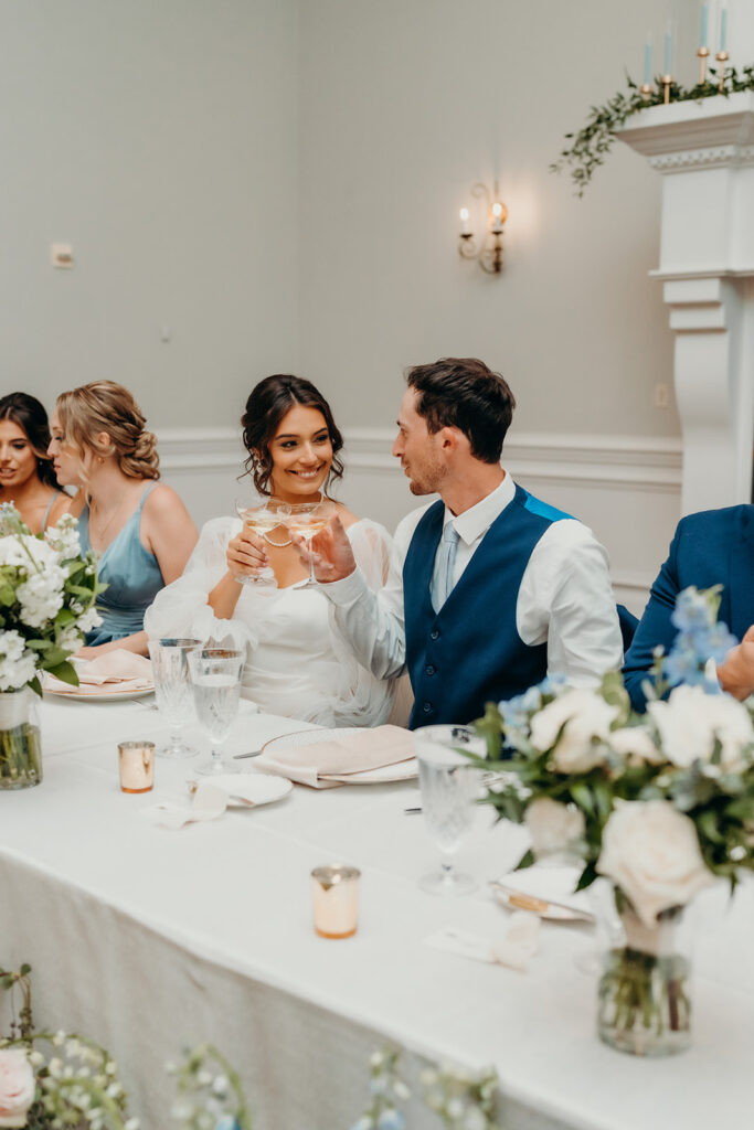 bride and groom doing a cheers after toasts at their rose hill estate wedding
