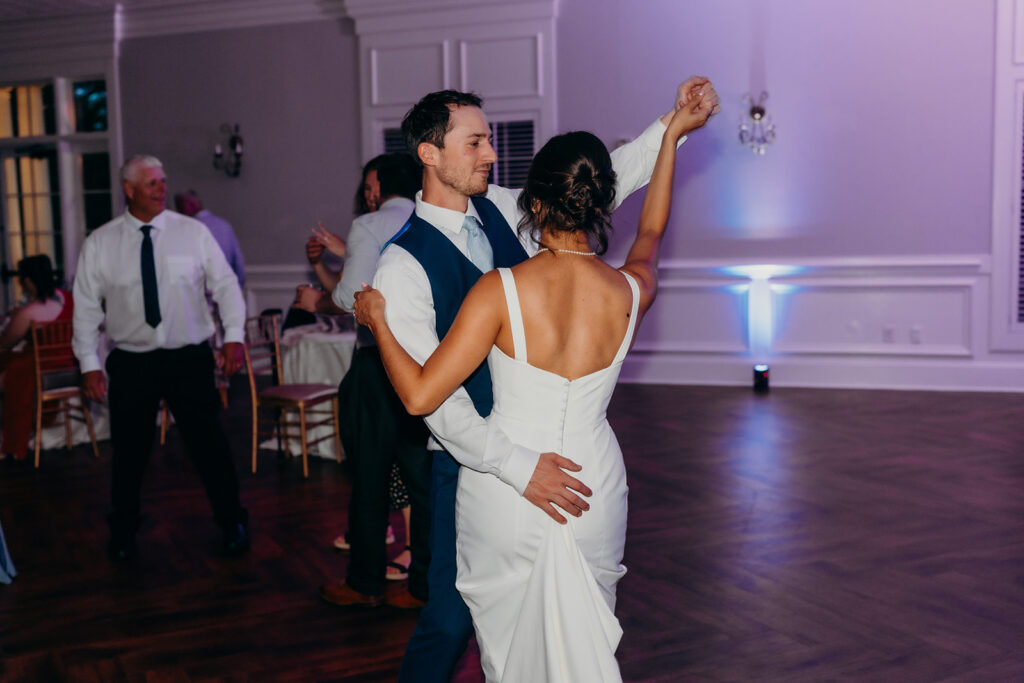 bride and groom on the dance floor at their rose hill estate wedding