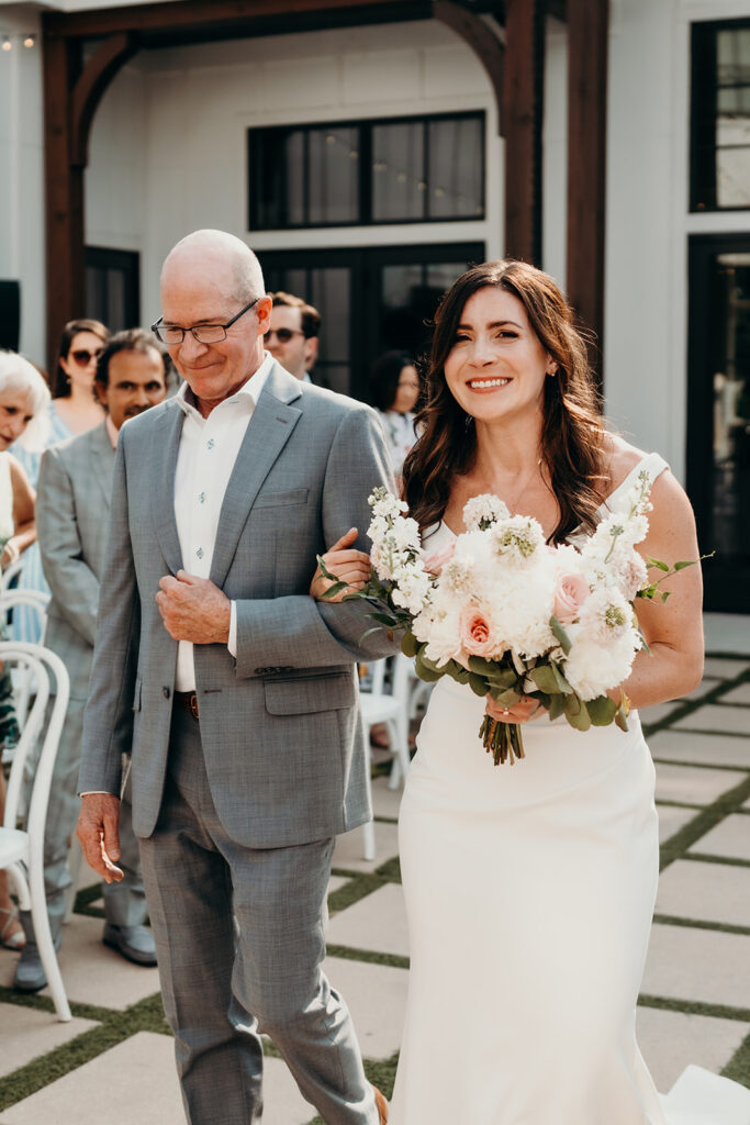 bride and father walking down the aisle