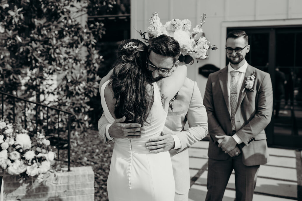 bride and groom hugging during ceremony