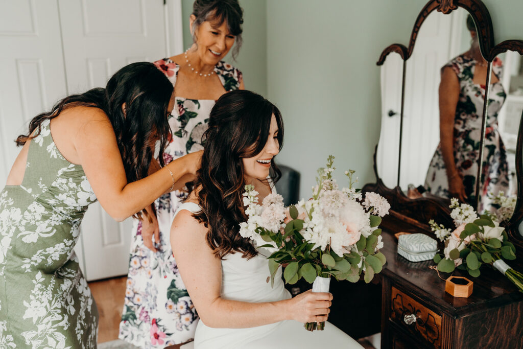 bride getting ready in bridal suite