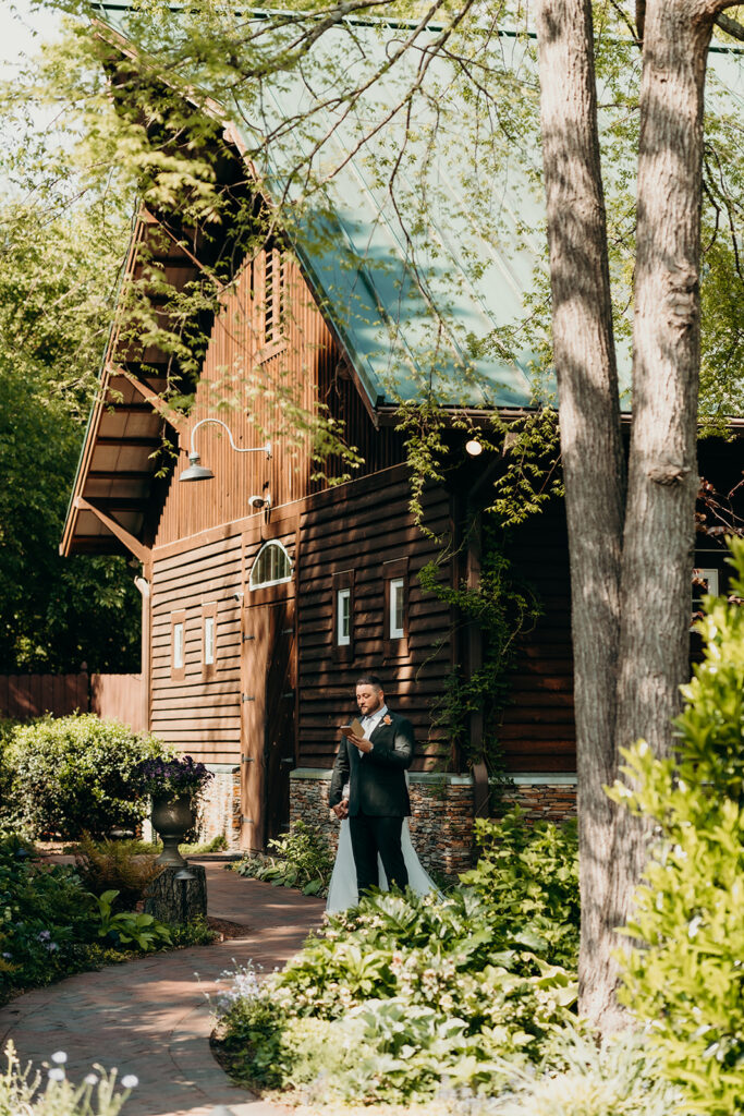 bride and groom private vows beside the barn