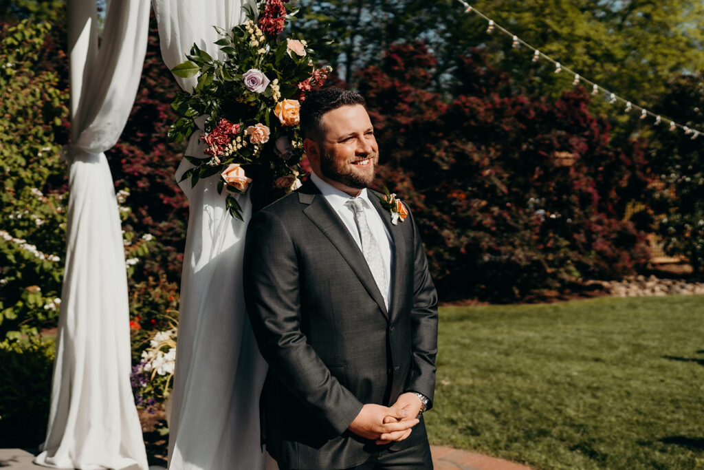 bride and groom during their ceremony groom reacting to seeing his bride