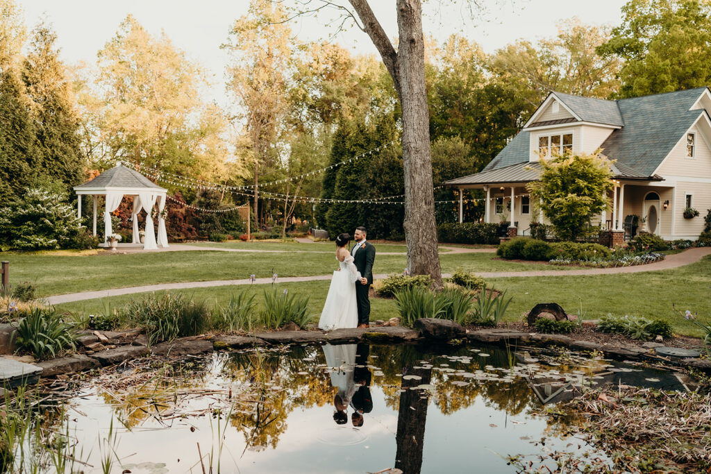 couple in front of the pond at golden hour sunset