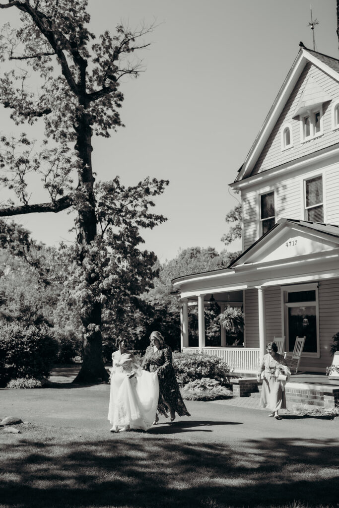 bride and dad doing a first look in the front lawn